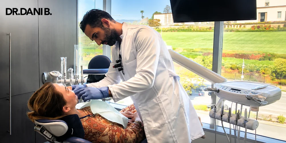 Dentist treating a patient in a modern dental office, illustrating Porcelain Veneers in Los Angeles and personalized cosmetic dental care